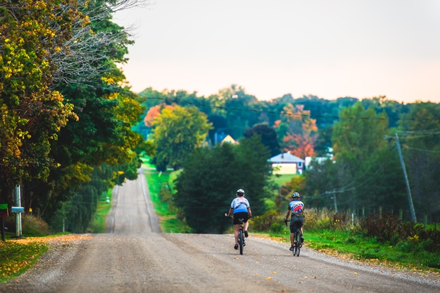 two riders cycling on an Oxford County gravel road