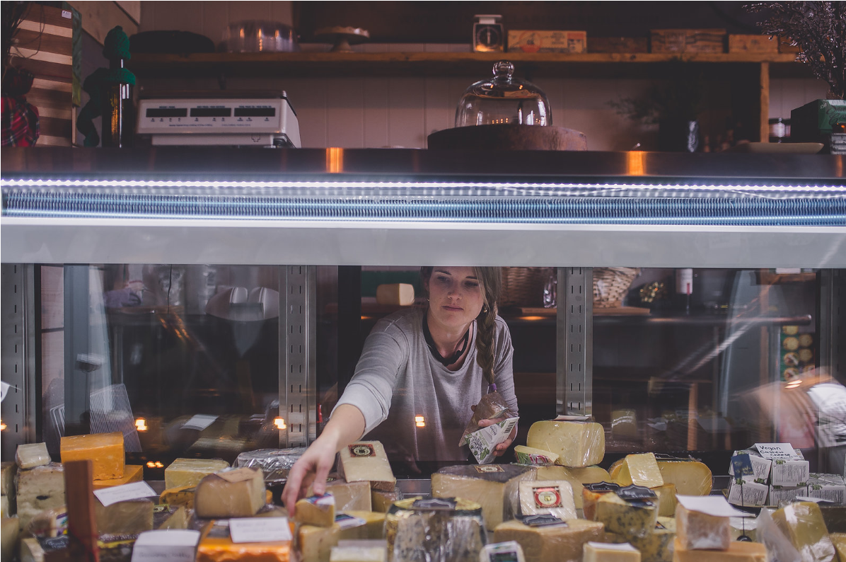 annelies grabbing cheese from counter