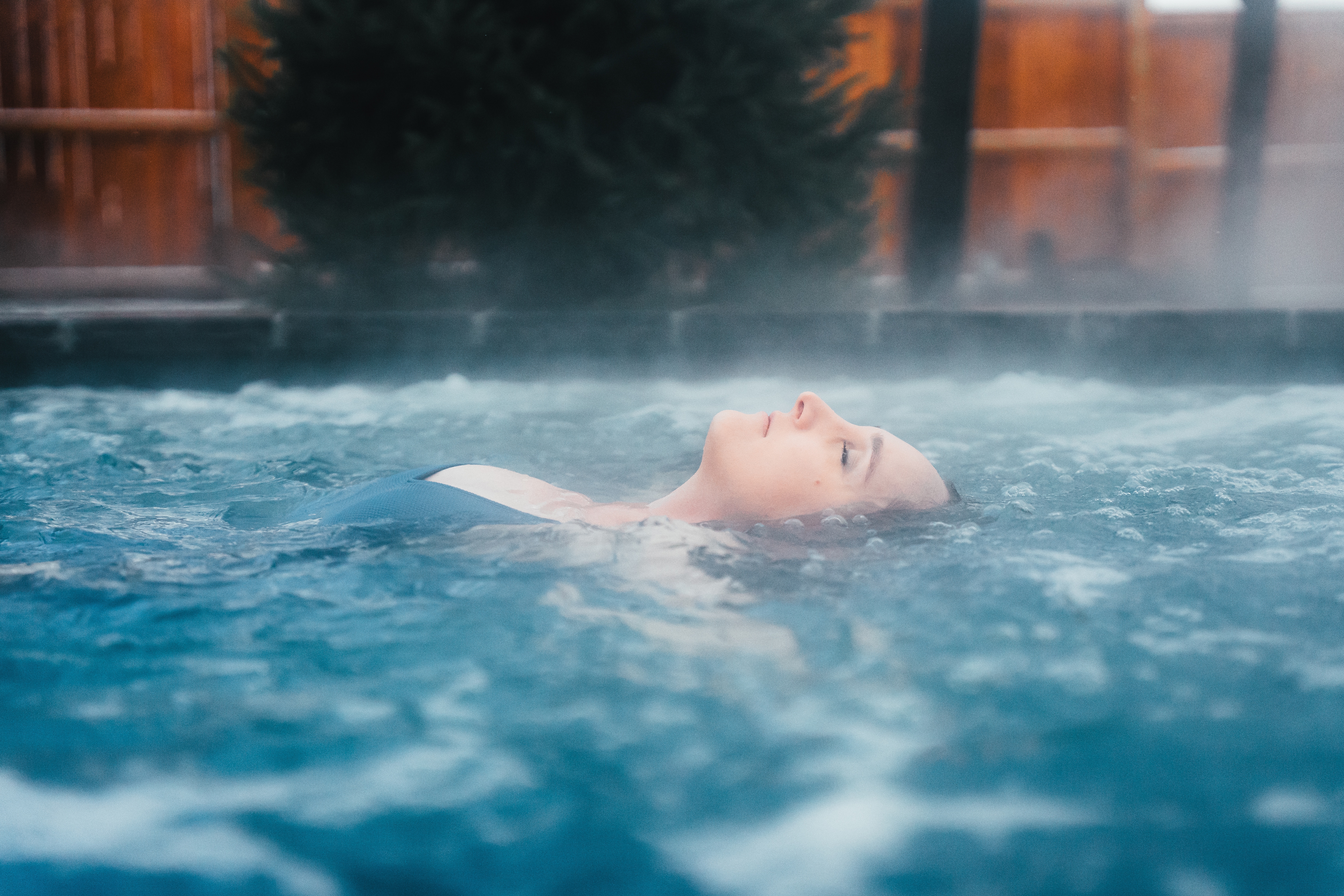 Woman floating in pool at Terra Nova Nordic Spa