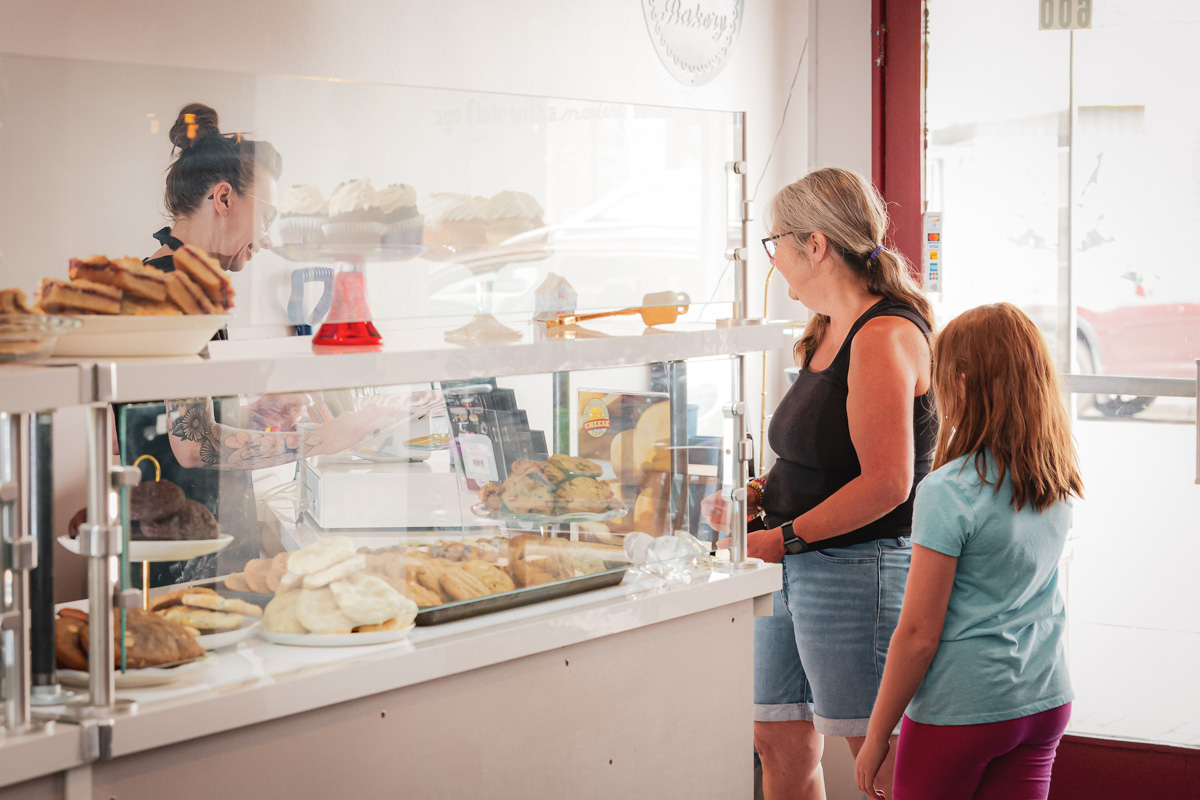 grandma and grandchild at bakery